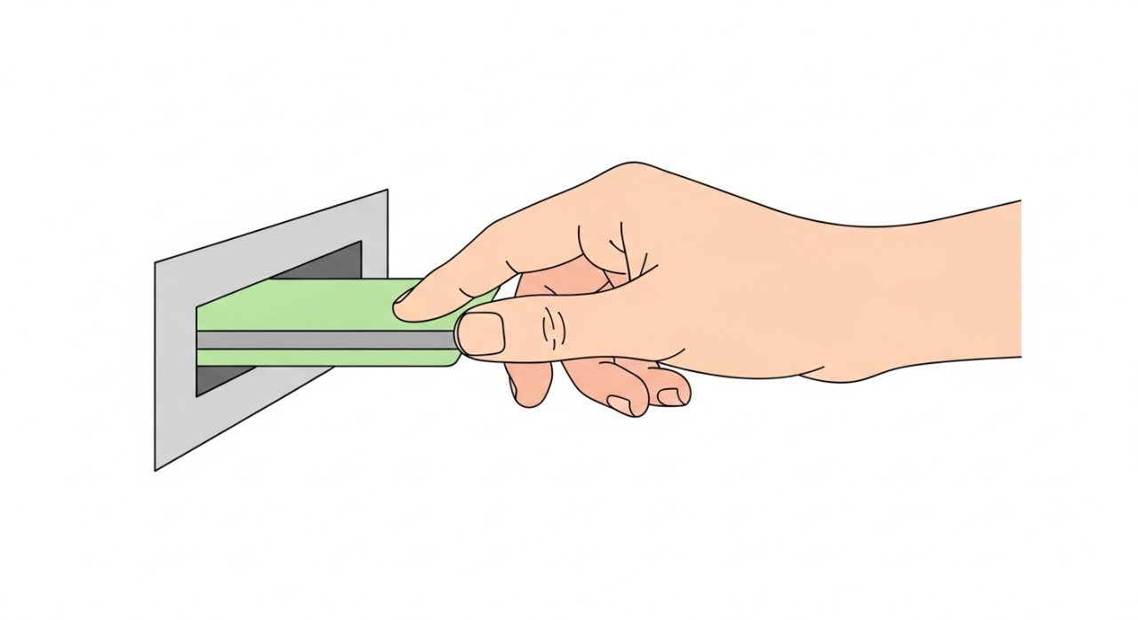 Panduan Terperinci Cara Keluarkan Duit Tabung Haji 1 Satu tangan memasukkan kad debit ke dalam slot mesin ATM yang direka ringkas.